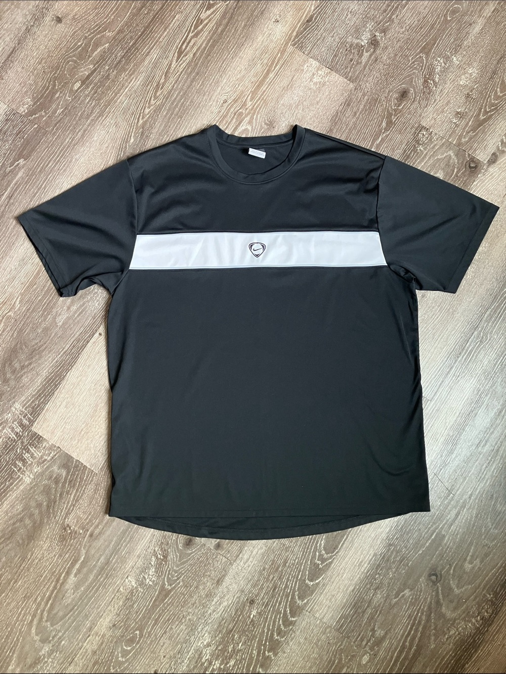 vintage black Nike short-sleeve athletic t-shirt centered circular Nike logo.